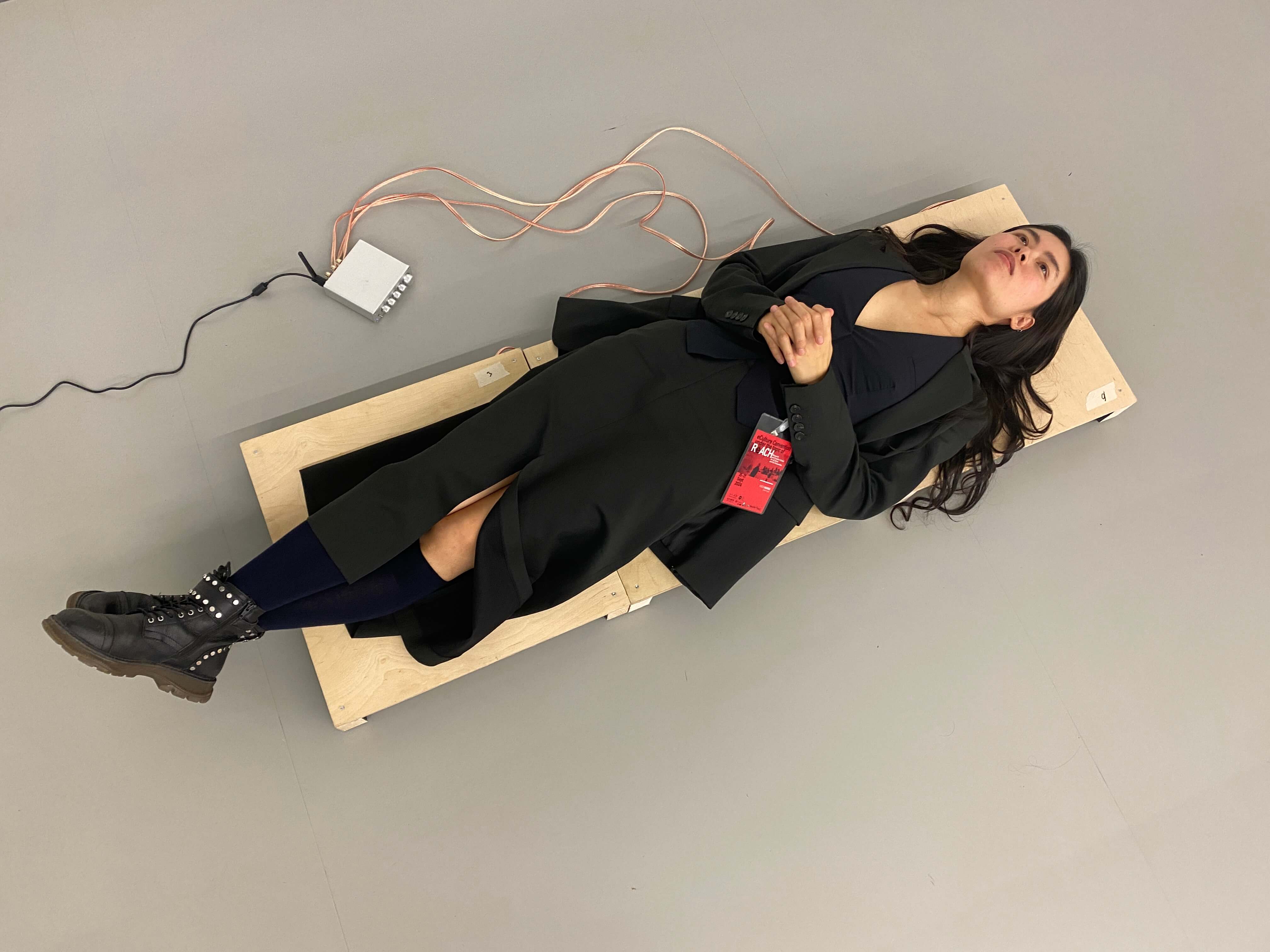 Test sample for a stand-alone amplifier, connected to 3 shaking devices underneath the boards. The data can be run directly through bluetooth into the amplifier, making the boards vibrate differently due to the data. From "Garden of Entanglement", 2024. In courtesy of the artist, Hiền Hoàng