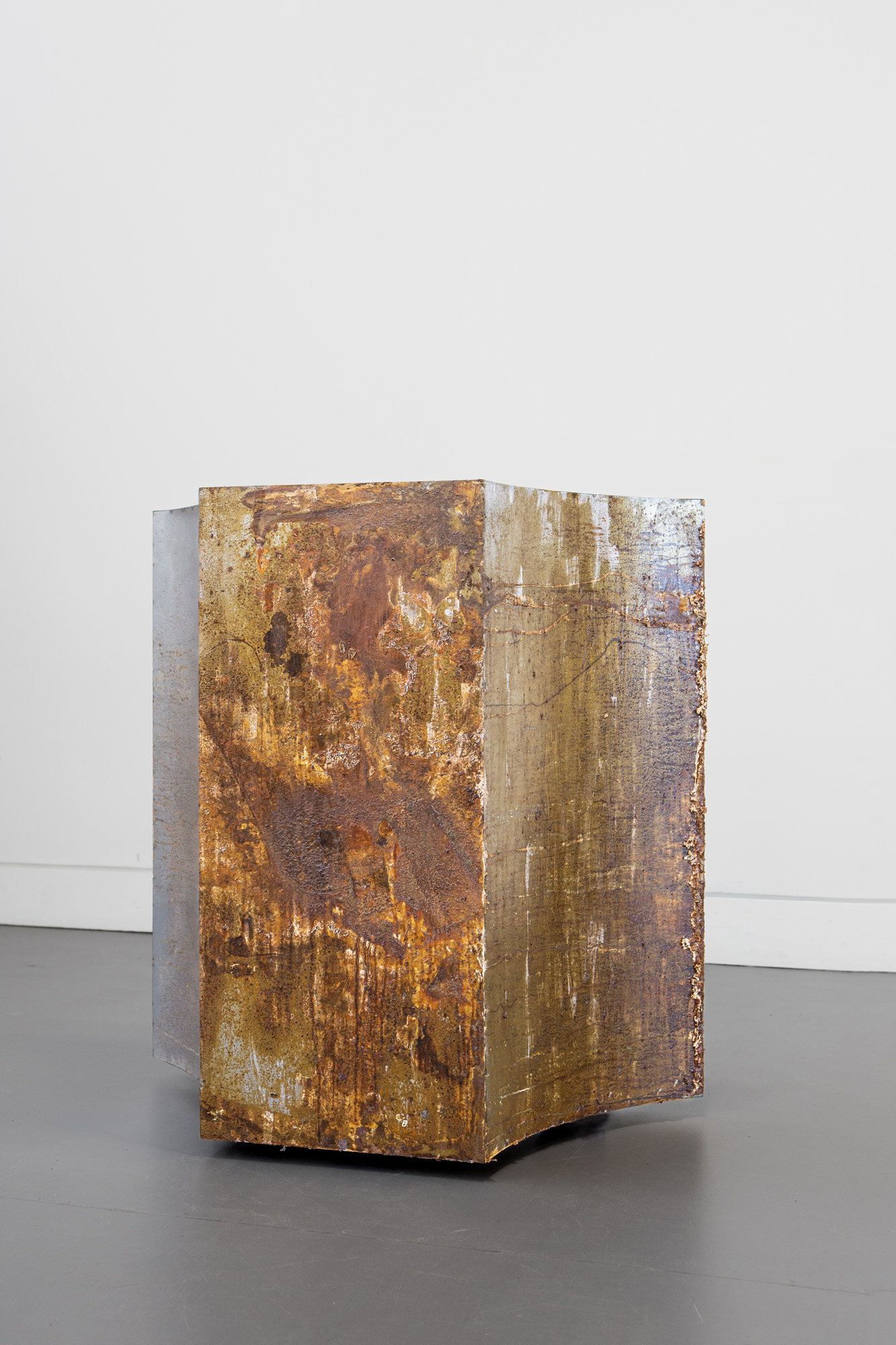Hien Hoang ,Slow Sculpture: Ground (2026–ongoing), steel, corrosion. 90 x 90 x 40 cm