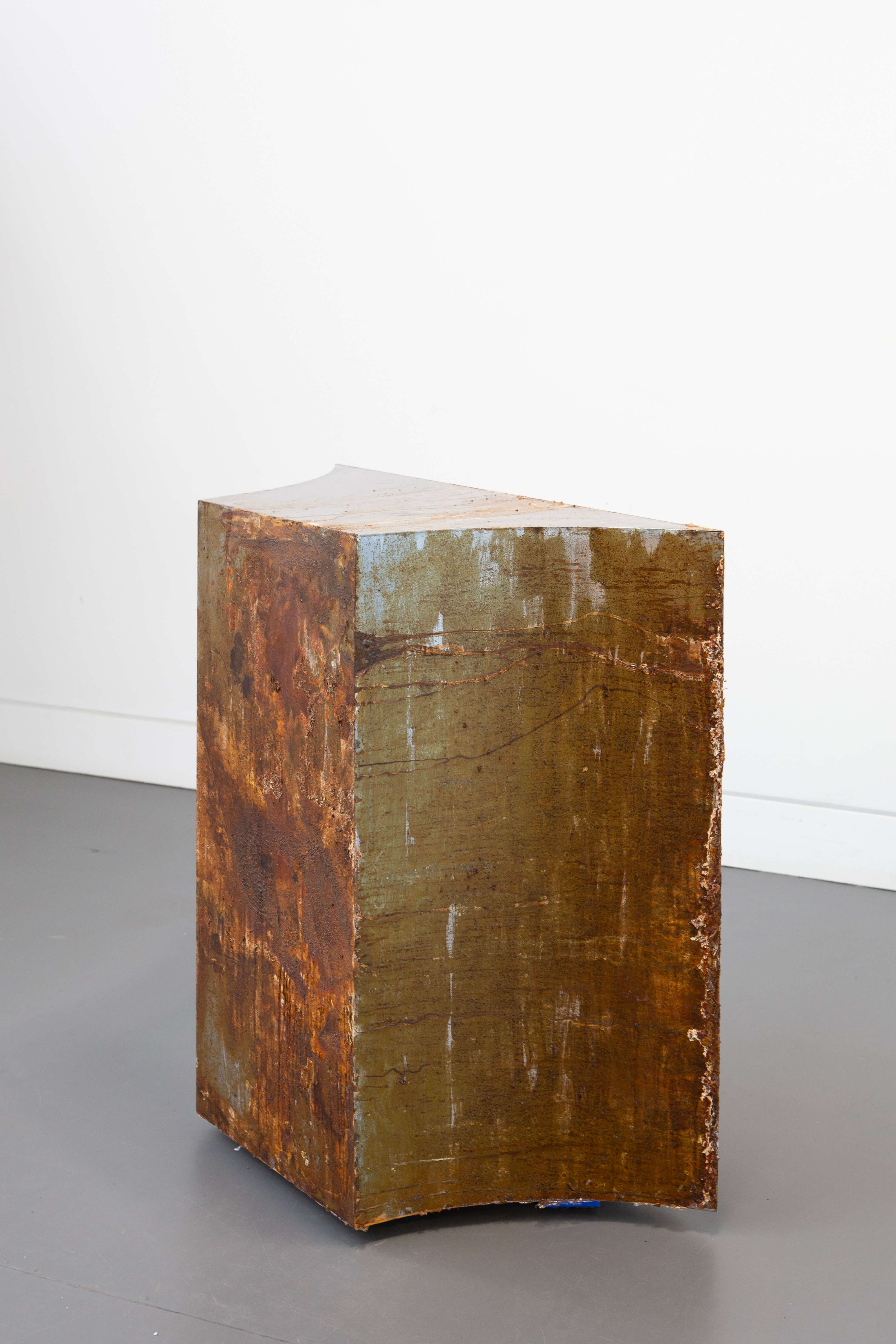 Hiền Hoàng, The Base, part of Slow Sculpture (2026–ongoing), corroded steel, 90 × 90 × 45 cm, left side view.